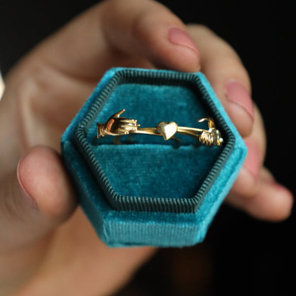 A well-preserved and highly collectible antique revival fede ring in solid 18k yellow gold!