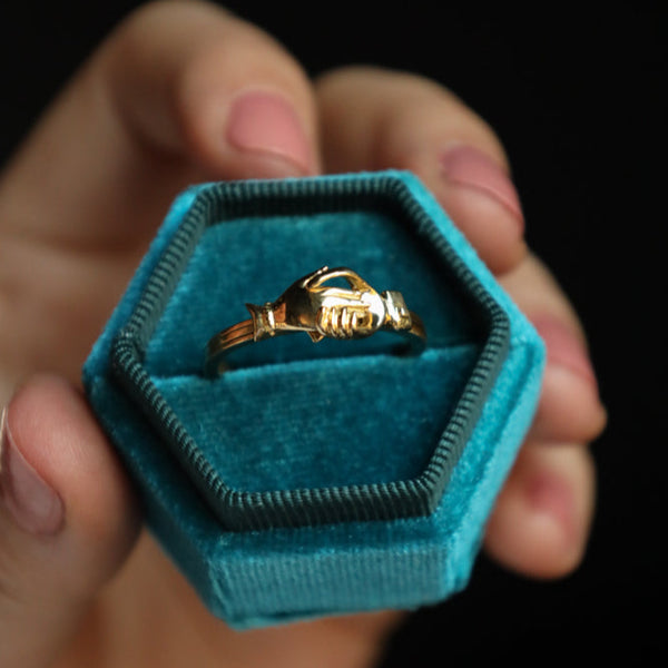 A well-preserved and highly collectible antique revival fede ring in solid 18k yellow gold!