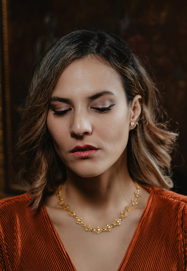 An artisan antique revival pair of solid 14k gold snake stud earrings. These snake earrings are made of pure 14 karat gold and are set with natural diamonds.  These earrings can be worn as a single stud or together as a pair. We have them both in white, rose and yellow gold, so please choose your preferred metal in the variations section.