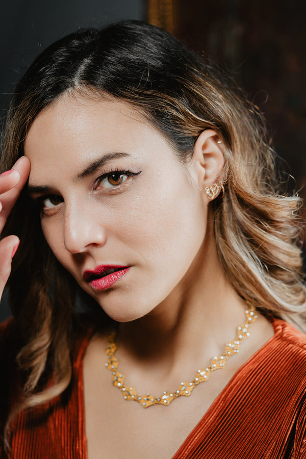 An artisan antique revival pair of solid 14k gold snake stud earrings. These snake earrings are made of pure 14 karat gold and are set with natural diamonds.  These earrings can be worn as a single stud or together as a pair. We have them both in white, rose and yellow gold, so please choose your preferred metal in the variations section.