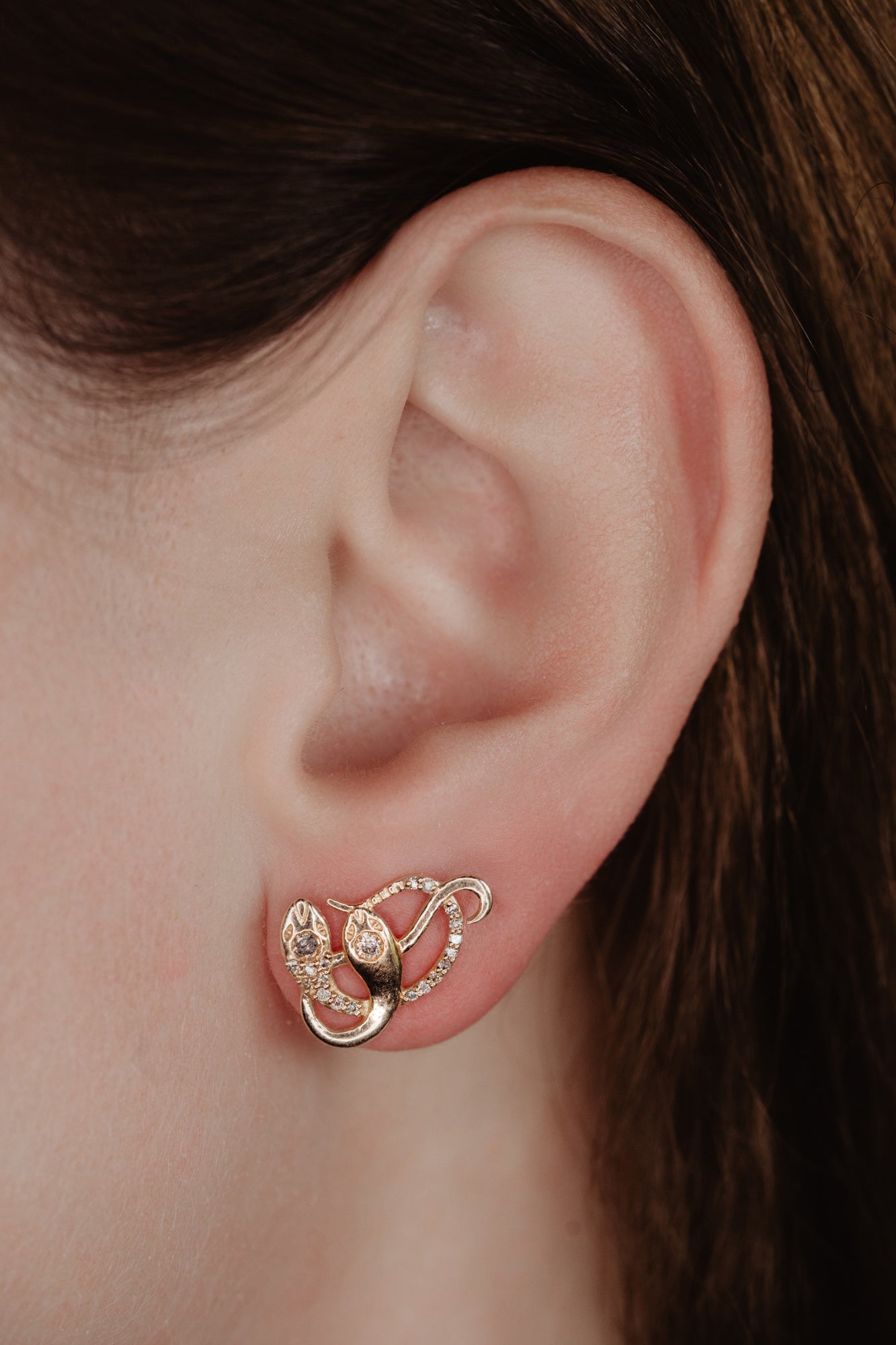 An artisan antique revival pair of solid 14k gold snake stud earrings. These snake earrings are made of pure 14 karat gold and are set with natural diamonds. These earrings can be worn as a single stud or together as a pair. We have them both in white, rose and yellow gold, so please choose your preferred metal in the variations section.