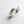 Silver cuff bracelet on a light gray background