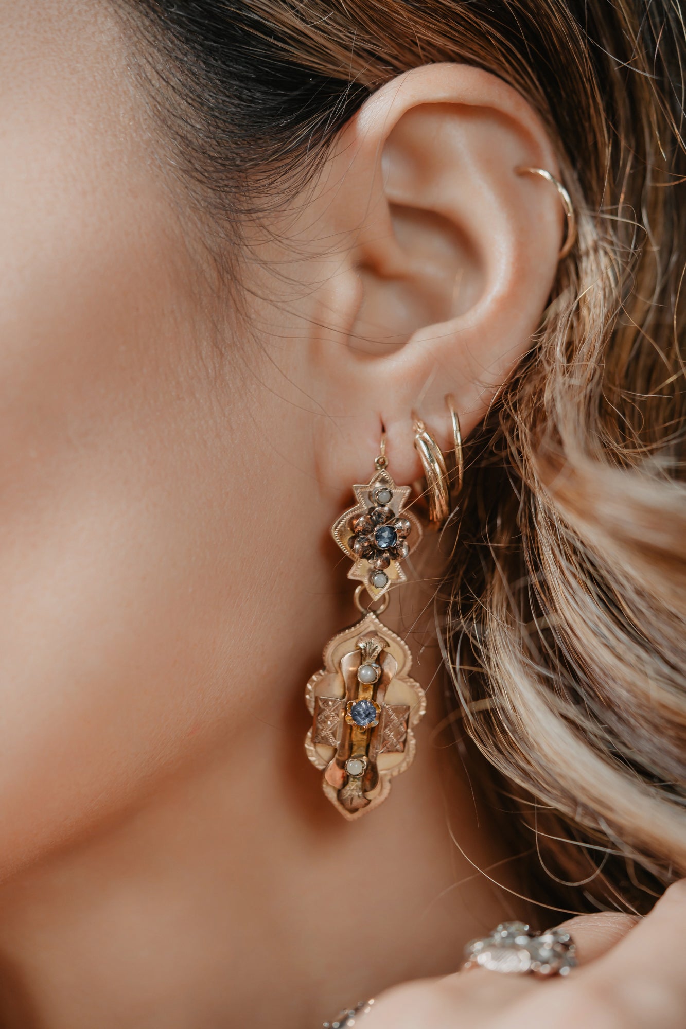 Statement and classy antique rose gold earrings. These feminine antique earrings are made of so-called borbonic gold (8kt) and are set with natural pearls and white saphirette glass. The gold has a warm rosy shade and is complimetary to any skin color.  The earrings consist of two parts - the main part and detachable lower chandelier. Such model is called day and night earrings.
