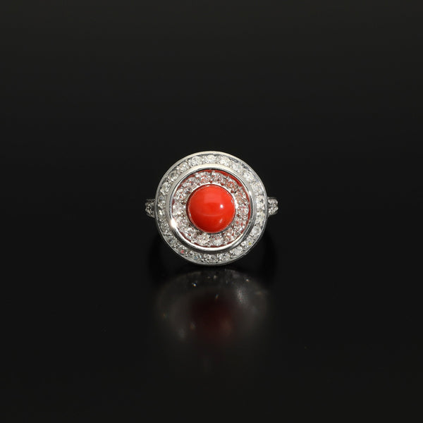 Absolutely STUNNING Art Deco coral and diamond ring. Born in the South of Italy, this magnificent ring is crafted in solid 18 kt white gold! The ring is heavy - it weights whooping 8 grams - and is preserved in a superb state. The round crown is set with a lovely Sicilian coral surrounded by a double halo of 40 sparkling diamonds.