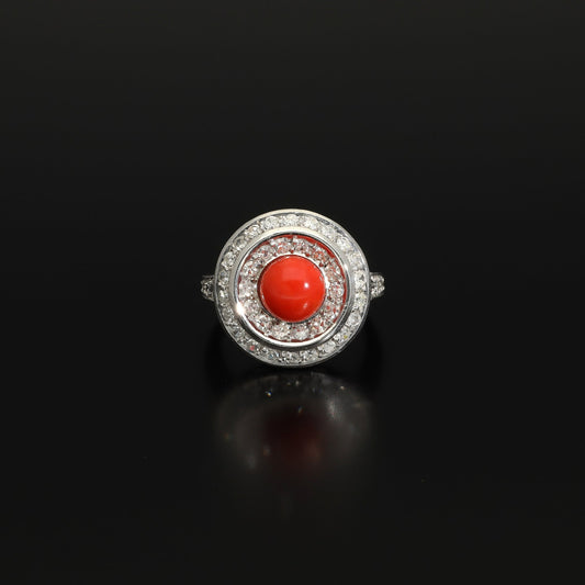Absolutely STUNNING Art Deco coral and diamond ring. Born in the South of Italy, this magnificent ring is crafted in solid 18 kt white gold! The ring is heavy - it weights whooping 8 grams - and is preserved in a superb state. The round crown is set with a lovely Sicilian coral surrounded by a double halo of 40 sparkling diamonds.
