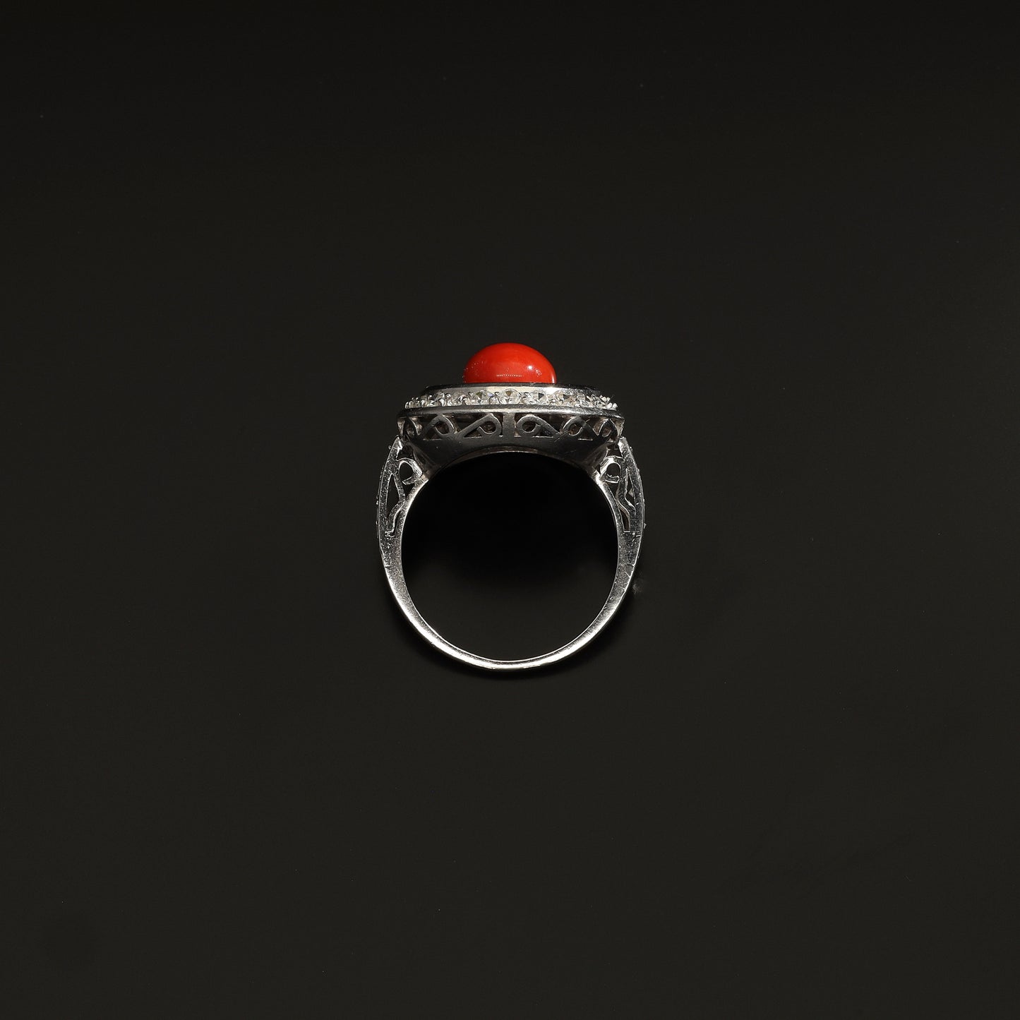 Absolutely STUNNING Art Deco coral and diamond ring. Born in the South of Italy, this magnificent ring is crafted in solid 18 kt white gold! The ring is heavy - it weights whooping 8 grams - and is preserved in a superb state. The round crown is set with a lovely Sicilian coral surrounded by a double halo of 40 sparkling diamonds.