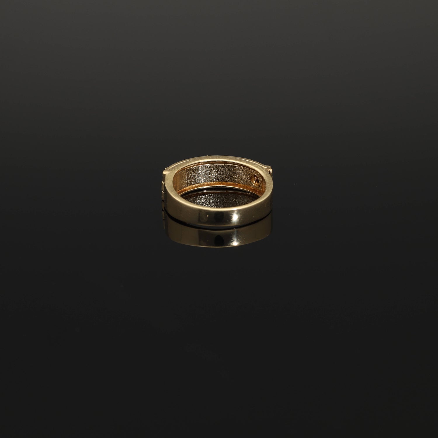 A unique unisex diamond secret compartment ring in solid 14k gold. This yellow gold so-called poison ring opens to a secret compartment which reads DARLING. A modern twist on Victorian era sentimental jewelry, this beautiful ring is produced on demand by our workshop.  The face of the ring has a celestial ornament depicting a star surrounded by foilate.