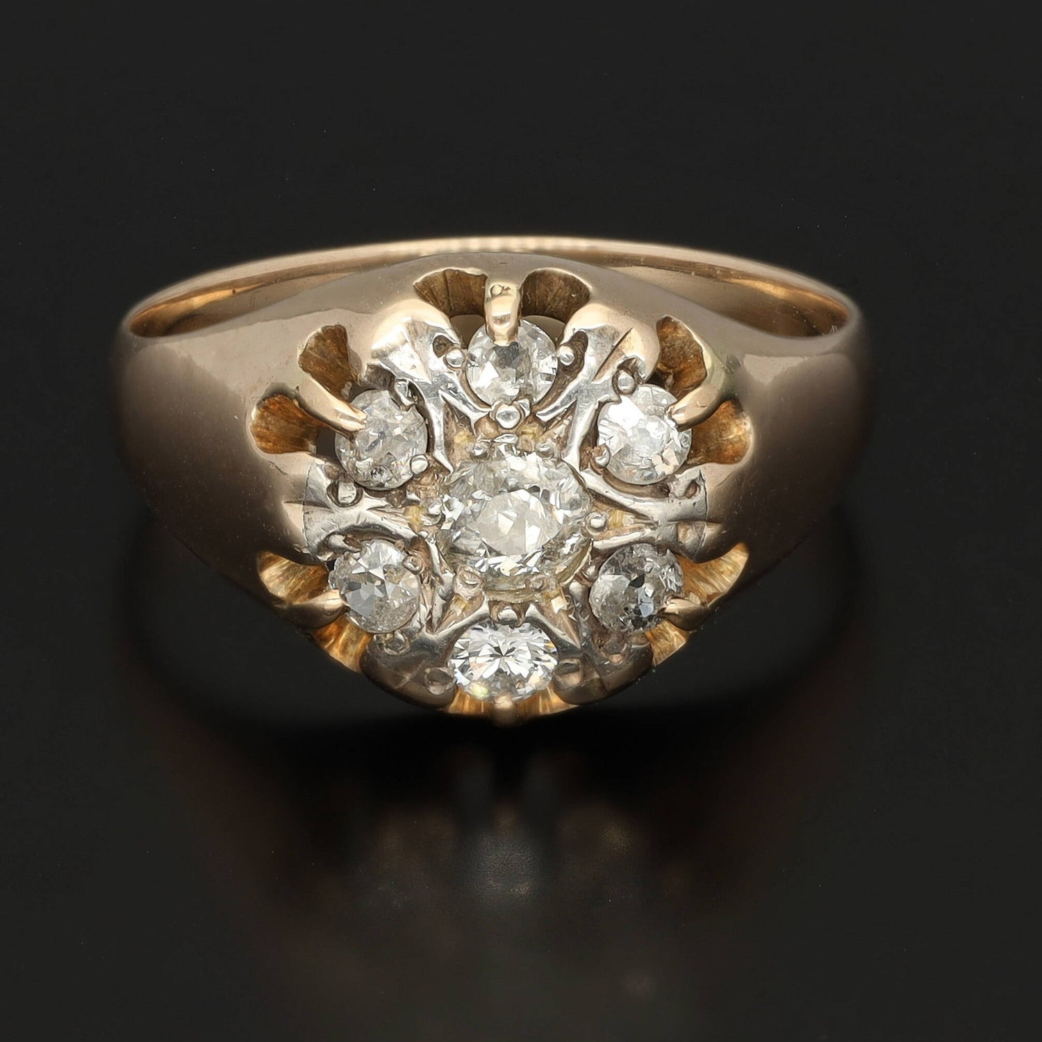 A substantial unisex diamond signet ring in solid 14k gold. This yellow gold signet ring is preserved in a superb condition and is fully hallmarked. The crown carries six 0.15 CT diamonds and the central diamond of circa 0.25 CT. The stones have a good quality SI1-2 and E-F color.   The face of the ring has a white gold plating surrounding the stones to enhance their shine. The body is made of yellow gold. The ring is a perfect vintage condition, cleaned and with serviced prongs.