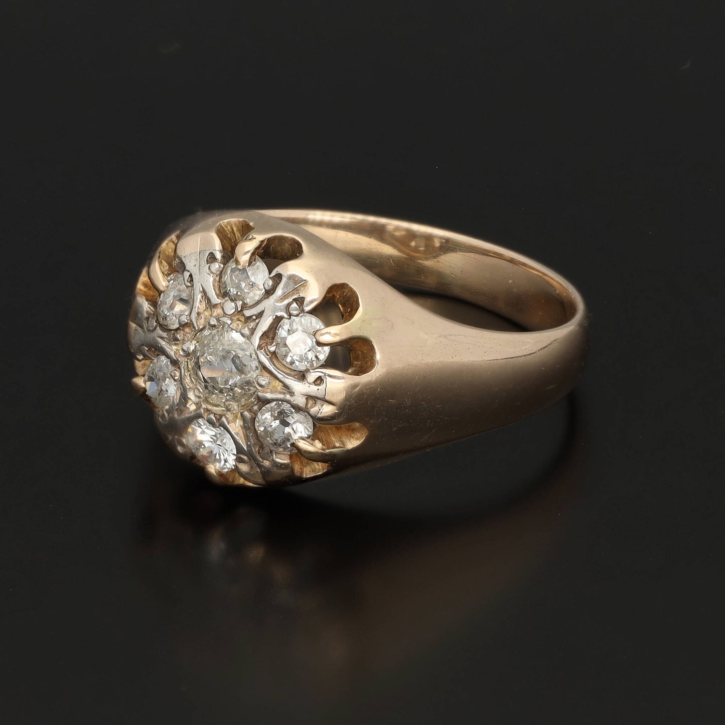 A substantial unisex diamond signet ring in solid 14k gold. This yellow gold signet ring is preserved in a superb condition and is fully hallmarked. The crown carries six 0.15 CT diamonds and the central diamond of circa 0.25 CT. The stones have a good quality SI1-2 and E-F color.   The face of the ring has a white gold plating surrounding the stones to enhance their shine. The body is made of yellow gold. The ring is a perfect vintage condition, cleaned and with serviced prongs.