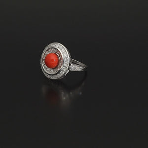 Absolutely STUNNING Art Deco coral and diamond ring. Born in the South of Italy, this magnificent ring is crafted in solid 18 kt white gold! The ring is heavy - it weights whooping 8 grams - and is preserved in a superb state. The round crown is set with a lovely Sicilian coral surrounded by a double halo of 40 sparkling diamonds.