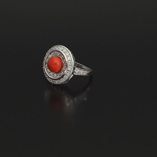 Absolutely STUNNING Art Deco coral and diamond ring. Born in the South of Italy, this magnificent ring is crafted in solid 18 kt white gold! The ring is heavy - it weights whooping 8 grams - and is preserved in a superb state. The round crown is set with a lovely Sicilian coral surrounded by a double halo of 40 sparkling diamonds.